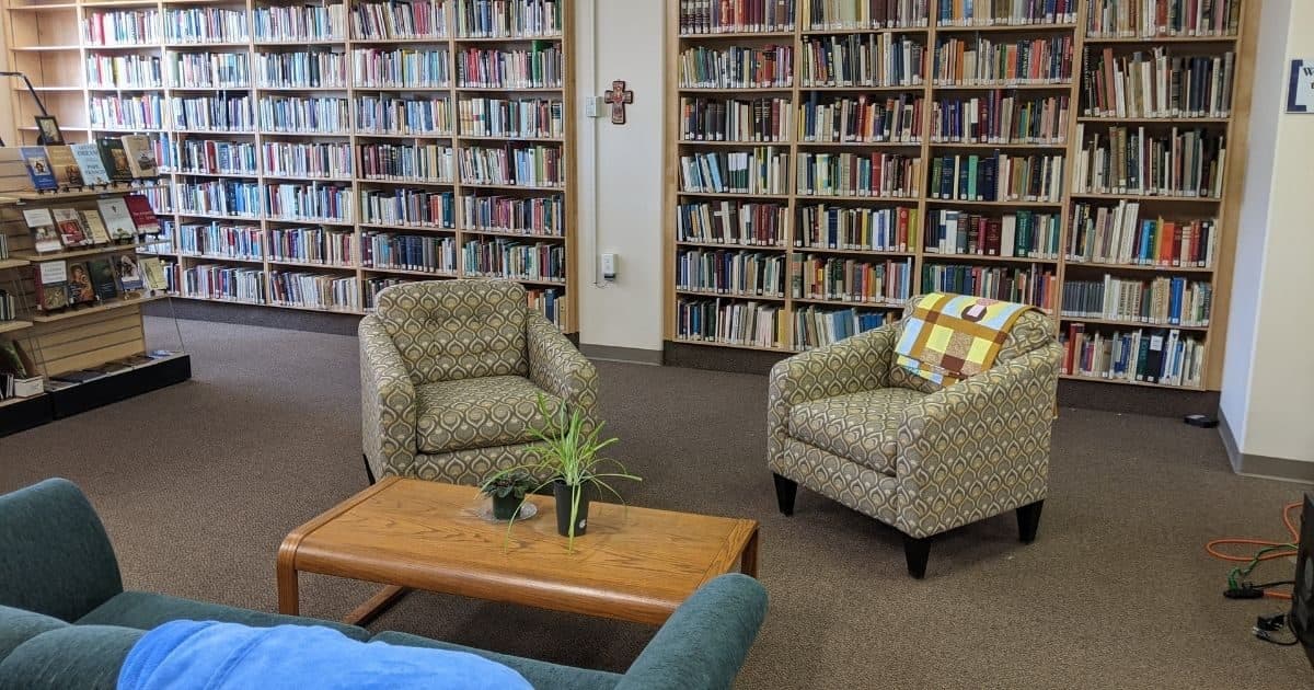 Welcoming church library with shelves of books and comfortable space for reading